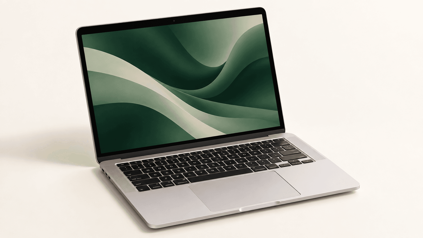 MacBook plateado abierto con la pantalla en tonos verdes.